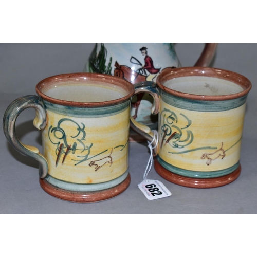 682 - A PAIR OF GLYN COLLEDGE OF DENBY HAND PAINTED HUNTING MUGS AND A BALUSTER SHAPED TANKARD, similarly ... 