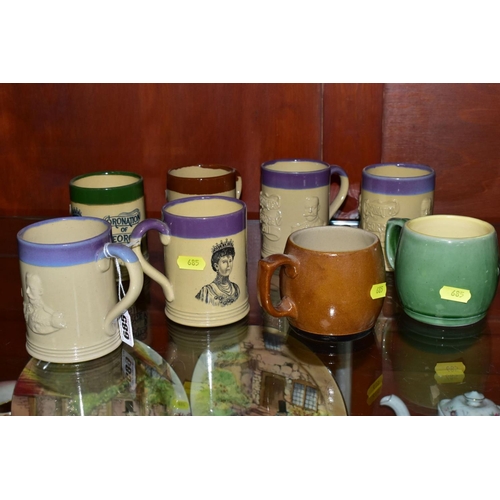 685 - A COLLECTION OF EIGHT BOURNE DENBY COMMEMORATIVE MUGS, a mixture of printed and relief decorated des... 