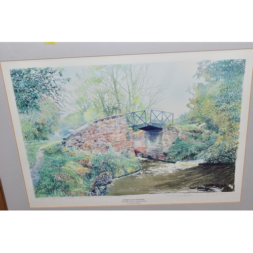 710 - FRAMED PRINTS, comprising a signed limited edition Eric Sturgeon rural village scene, framed, approx... 