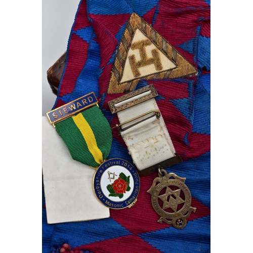 76 - TWO CASES OF MASONIC REGALIA, to include Masonic aprons, one with a blue, purple and white design th... 