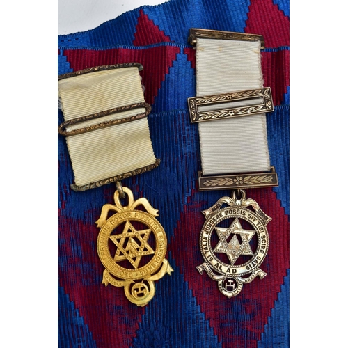 76 - TWO CASES OF MASONIC REGALIA, to include Masonic aprons, one with a blue, purple and white design th... 