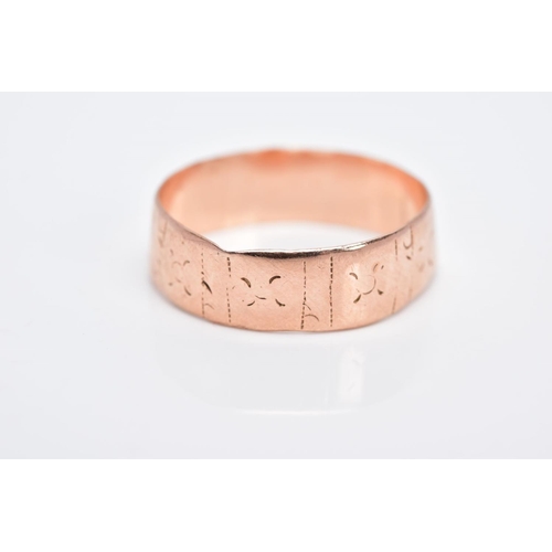 8 - A 9CT GOLD WIDE BAND, with a worn engraved pattern all round, hallmarked 9ct gold Chester 1882, ring... 