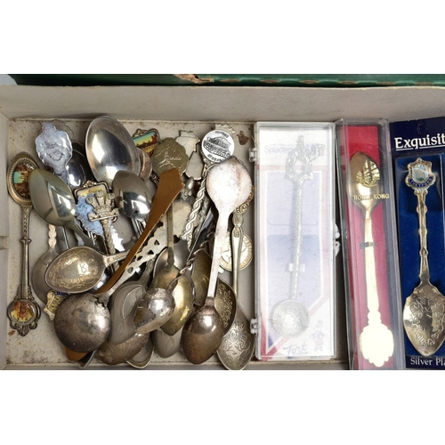 88 - A BOX OF FLATWARE AND TWO WOODEN DISPLAY RACKS, to include a shoe box of collectable white metal tea... 