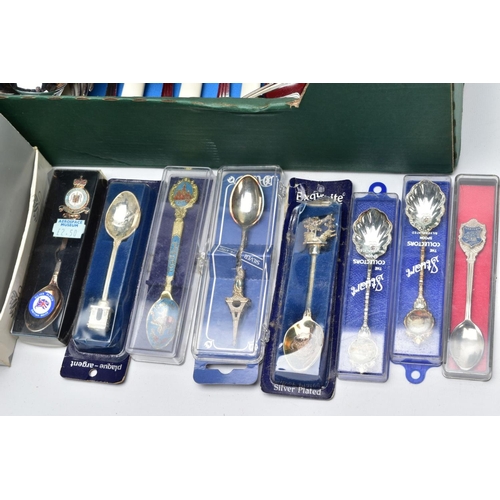 88 - A BOX OF FLATWARE AND TWO WOODEN DISPLAY RACKS, to include a shoe box of collectable white metal tea... 