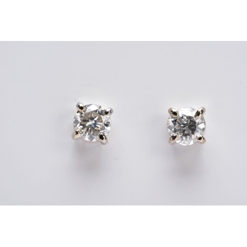 119 - A MODERN PAIR OF 18CT WHITE GOLD DIAMOND STUD EARRINGS, estimated total modern round brilliant cut w... 