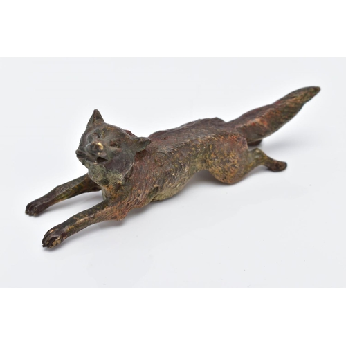 12 - A COLD PAINTED BRONZE FOX, in a running position holding something in its mouth, approximate length ... 