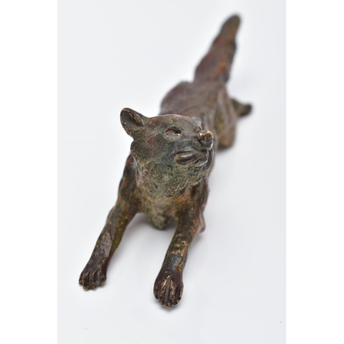 12 - A COLD PAINTED BRONZE FOX, in a running position holding something in its mouth, approximate length ... 