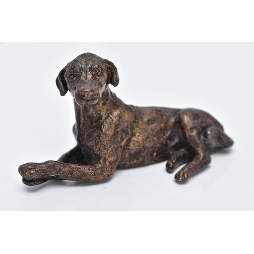 13 - A SMALL BRONZED DOG, in a lying down position, approximate length 70.4mm