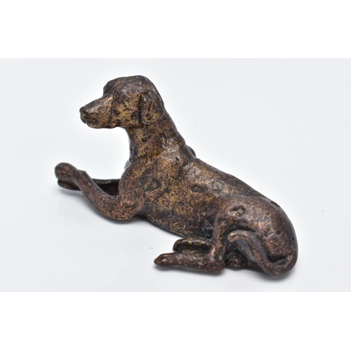 13 - A SMALL BRONZED DOG, in a lying down position, approximate length 70.4mm