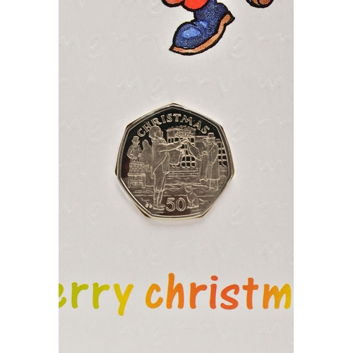 137 - POBJOY ISLE OF MAN CHRISTMAS FIFTY PENCE COINS, to include Newspaper Seller 1992 on greeting card, 1... 