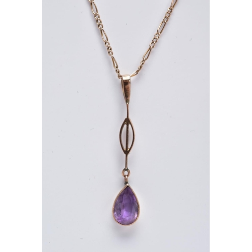 15 - A YELLOW METAL AMETHYST PENDANT NECKLACE, the drop pendant set with a pear cut amethyst within a col... 