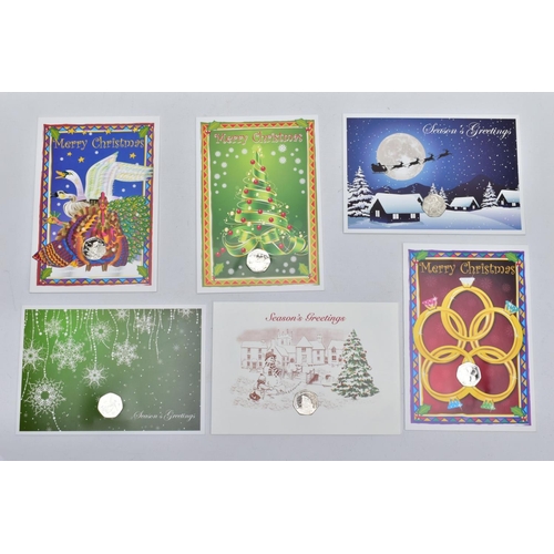 151 - A GROUP OF ISLE OF MAN CHRISTMAS FIFTY PENCE COINS, all diamond finished on greeting cards with C.O.... 