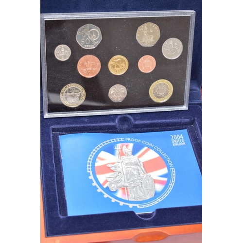 162 - ROYAL MINT EXECUTIVE PROOF COLLECTION OF COINS presented in a wooden fitted case 2004 ten coins, 200... 