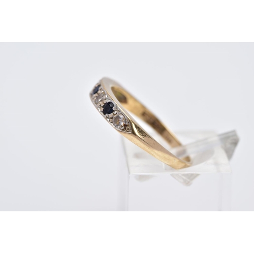 17 - A 9CT GOLD SAPPHIRE AND CUBIC ZIRCONIA HALF HOOP RING, designed with a row of three circular cut blu... 