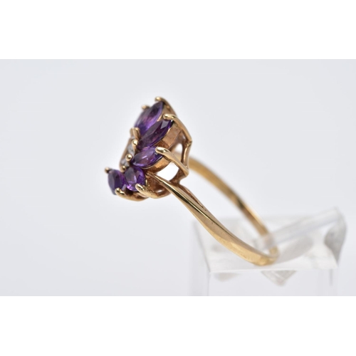 18 - A 9CT GOLD AMETHYST RING, designed as a spray of marquise cut amethyst with a single cut diamond det... 