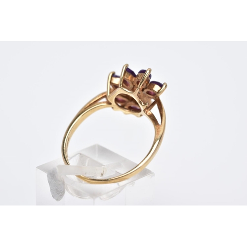 18 - A 9CT GOLD AMETHYST RING, designed as a spray of marquise cut amethyst with a single cut diamond det... 