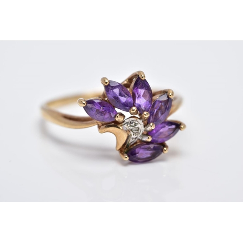 18 - A 9CT GOLD AMETHYST RING, designed as a spray of marquise cut amethyst with a single cut diamond det... 