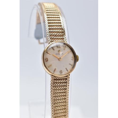 22 - A LADIES MID TO LATE 20TH CENTURY 9CT GOLD OMEGA WRISTWATCH, round silver dial signed 'Omega', Arabi... 