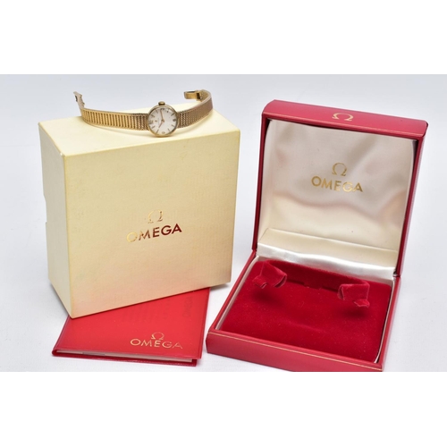 22 - A LADIES MID TO LATE 20TH CENTURY 9CT GOLD OMEGA WRISTWATCH, round silver dial signed 'Omega', Arabi... 