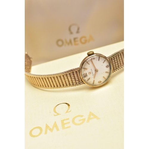 22 - A LADIES MID TO LATE 20TH CENTURY 9CT GOLD OMEGA WRISTWATCH, round silver dial signed 'Omega', Arabi... 