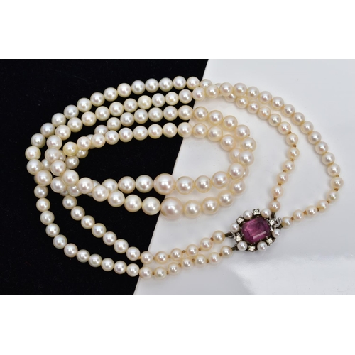 24 - A CULTURED PEARL NECKLACE, designed with two strands of graduated cultured pearls, measuring approxi... 