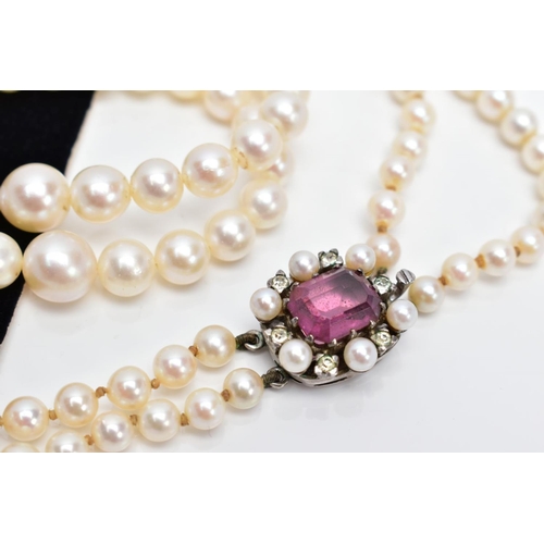 24 - A CULTURED PEARL NECKLACE, designed with two strands of graduated cultured pearls, measuring approxi... 