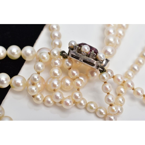 24 - A CULTURED PEARL NECKLACE, designed with two strands of graduated cultured pearls, measuring approxi... 