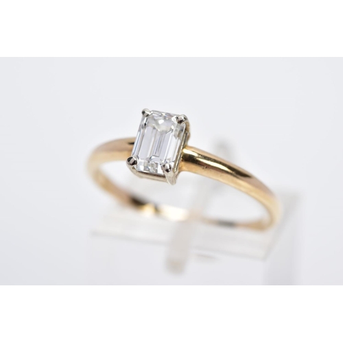 27 - A MODERN SINGLE STONE DIAMOND RING, designed with a claw set emerald cut diamond, total estimated di... 