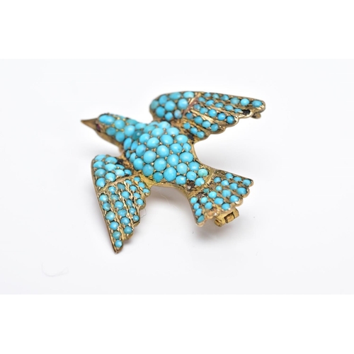 31 - A VICTORIAN SILVER GILT TURQUOISE SET BROOCH, in the form of a bird set with red paste eyes and an e... 