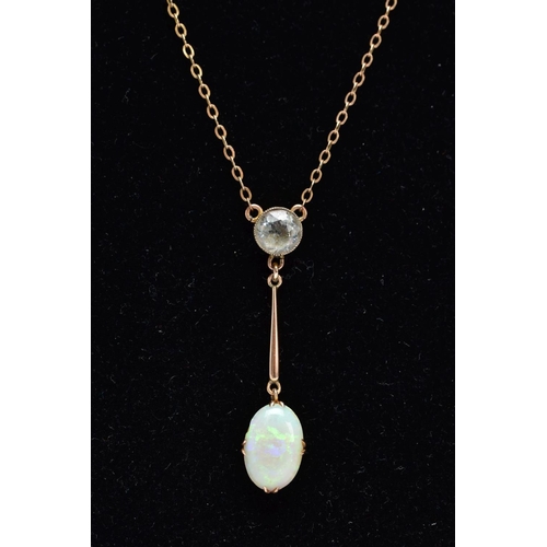 36 - AN EARLY 20TH CENTURY OPAL AND AQUAMARINE TWO STONE PENDANT, an oval opal measuring approximately 21... 