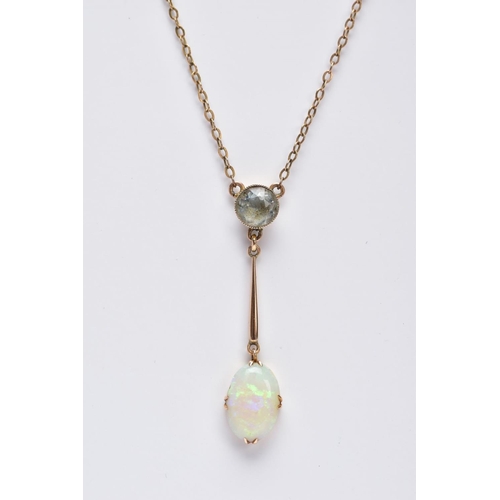 36 - AN EARLY 20TH CENTURY OPAL AND AQUAMARINE TWO STONE PENDANT, an oval opal measuring approximately 21... 