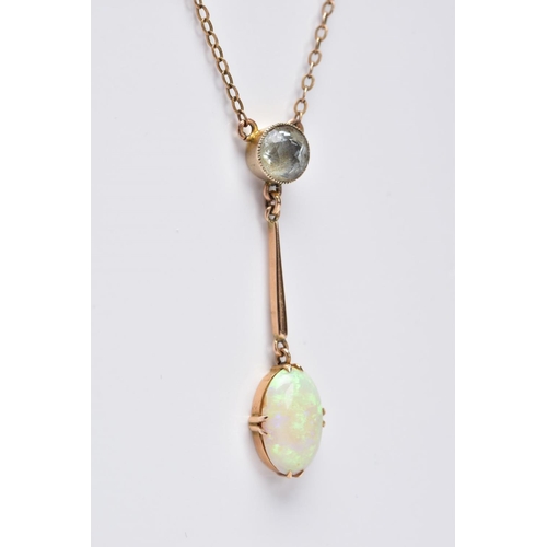 36 - AN EARLY 20TH CENTURY OPAL AND AQUAMARINE TWO STONE PENDANT, an oval opal measuring approximately 21... 