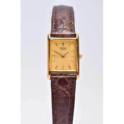 37 - A LADIES GOLD PLATED SEIKO WRISTWATCH, rectangular gold coloured dial signed 'Seiko quartz', baton m... 