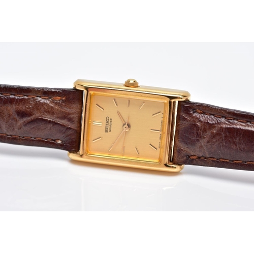 37 - A LADIES GOLD PLATED SEIKO WRISTWATCH, rectangular gold coloured dial signed 'Seiko quartz', baton m... 