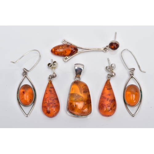 39 - A COLLECTION OF MODERN AMBER JEWELLERY, to include an abstract shaped pendant, two pairs of drop ear... 