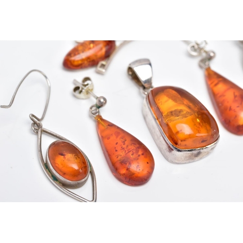 39 - A COLLECTION OF MODERN AMBER JEWELLERY, to include an abstract shaped pendant, two pairs of drop ear... 