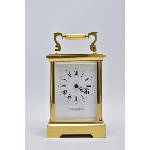 42 - A TAYLOR AND BLIGH CARRIAGE CLOCK, modern battery operated carriage clock with a white dial, signed ... 