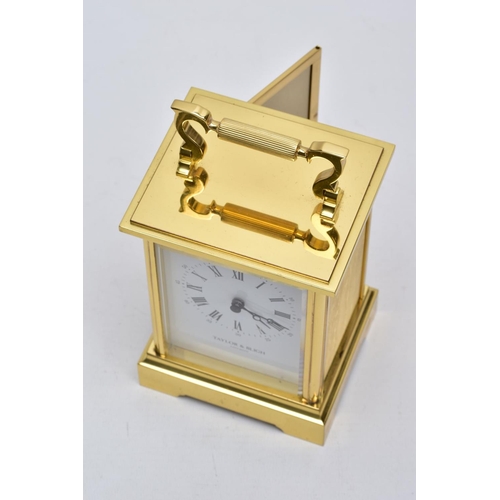 42 - A TAYLOR AND BLIGH CARRIAGE CLOCK, modern battery operated carriage clock with a white dial, signed ... 