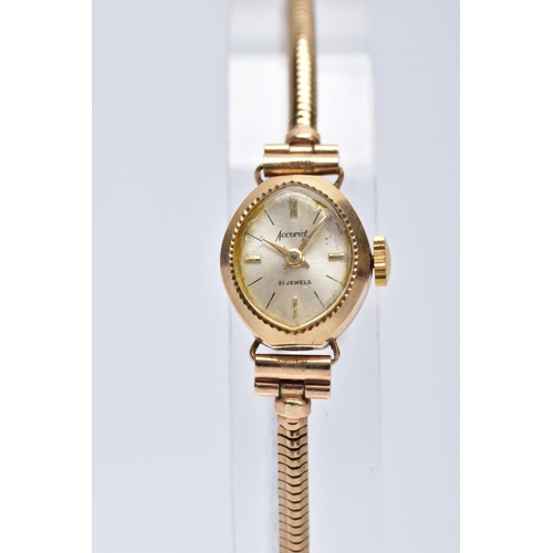 52 - A LADIES 9CT GOLD ACCURIST WRISTWATCH, oval silver dial signed 'Accurist 21 jewels',  baton markers ... 