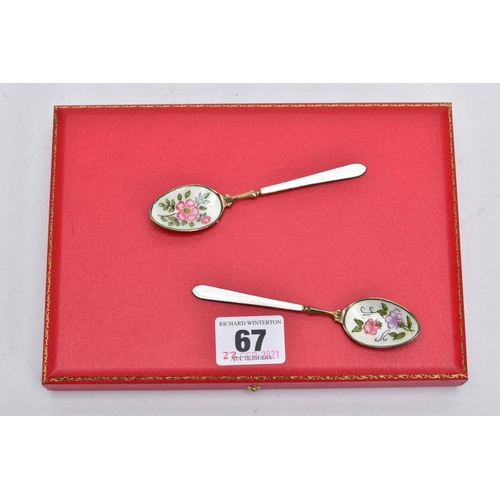 67 - A CASED SET OF SIX SILVER ENAMELLED COFFEE SPOONS, each silver gilt spoon has a decorative floral en... 