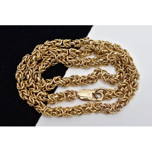 75 - A YELLOW METAL HEAVY CHAIN, byzantine chain designed with plain and textured multi joined circular l... 