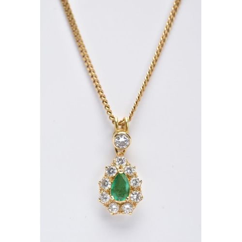 83 - AN EMERALD AND DIAMOND PENDANT NECKLET, the yellow metal tear drop pendant set with a central pear c... 