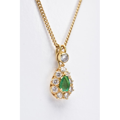 83 - AN EMERALD AND DIAMOND PENDANT NECKLET, the yellow metal tear drop pendant set with a central pear c... 