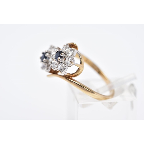 84 - A 9CT GOLD SAPPHIRE AND CUBIC ZIRCONIA DOUBLE CLUSTER RING, designed with two asymmetrical clusters,... 