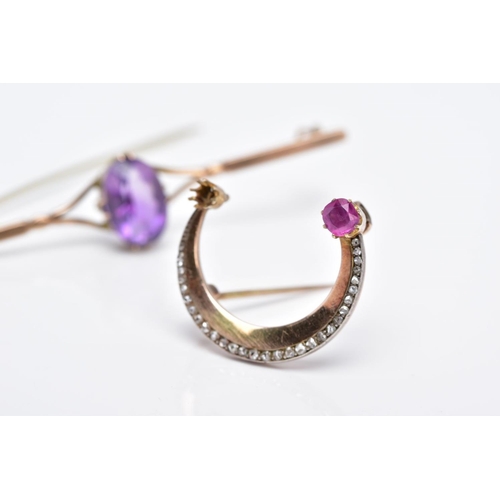 86 - TWO YELLOW METAL BROOCHES, the first bar brooch designed with a claw set oval cut amethyst, bifurcat... 