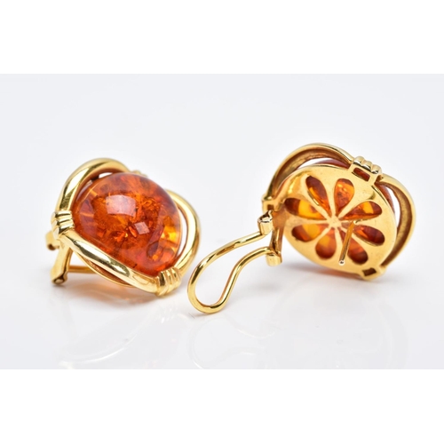 87 - A PAIR OF YELLOW METAL, AMBER CABOCHON EARRINGS, each designed with a circular cabochon amber within... 