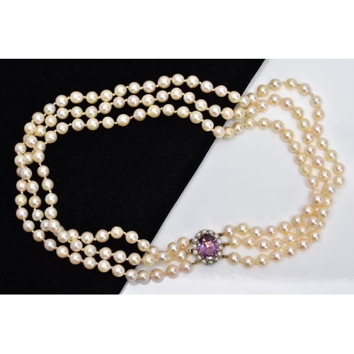 89 - A MULTI STRAND CULTURED PEARL NEACKLACE, designed with three strands of cultured pearls, approximate... 