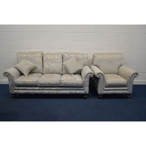 1365 - AN UPHOLSTERED TWO PIECE LOUNGE SUITE, on turned front legs, comprising a gold floral upholstered th... 