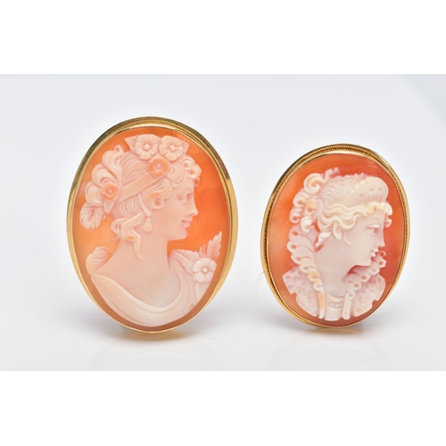 62 - TWO YELLOW METAL CAMEO BROOCHES, each of an oval form depicting a lady in profile within a collet mo... 