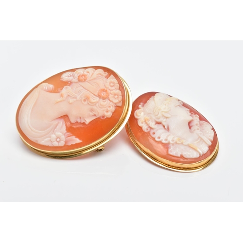 62 - TWO YELLOW METAL CAMEO BROOCHES, each of an oval form depicting a lady in profile within a collet mo... 